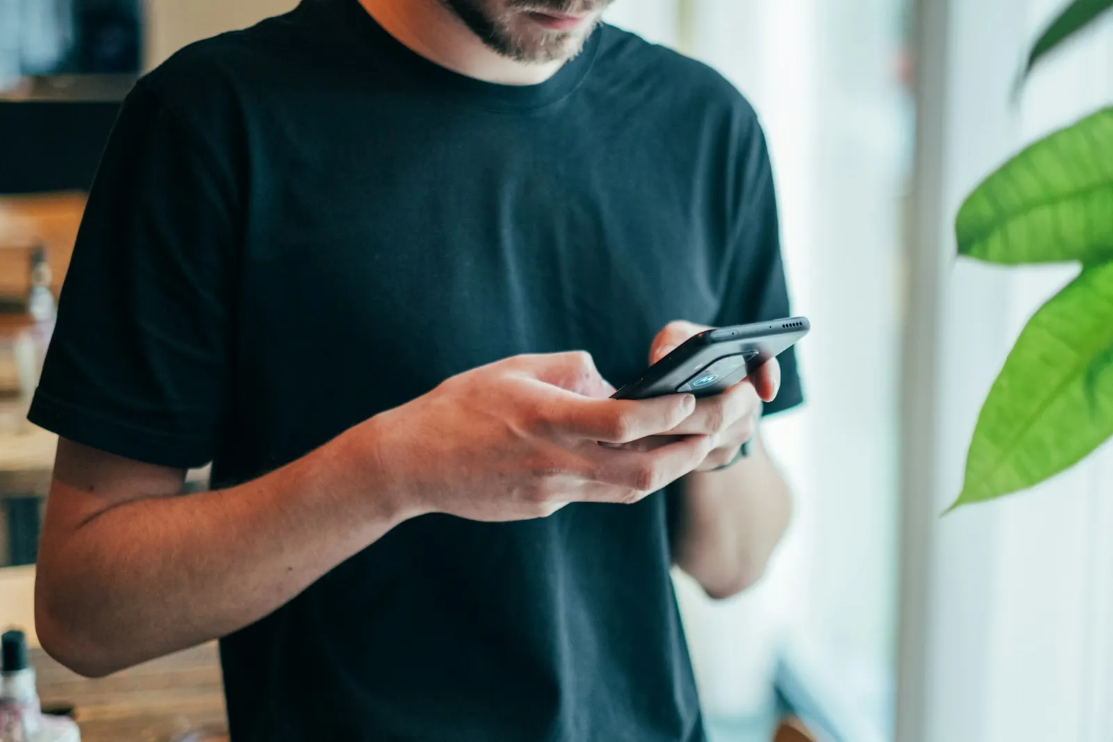 A man reading something on his phone