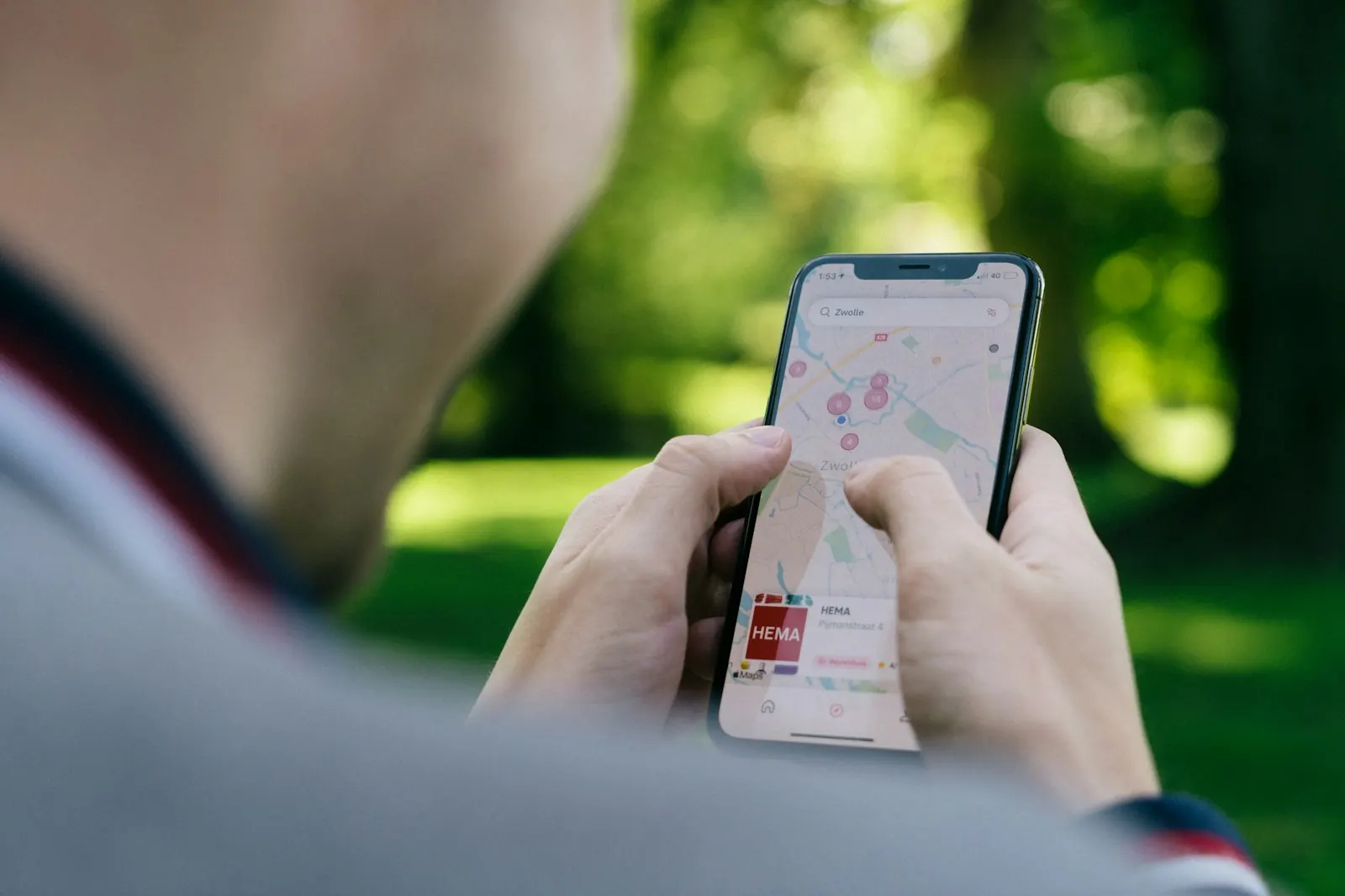 A person searching Google Maps on a phone